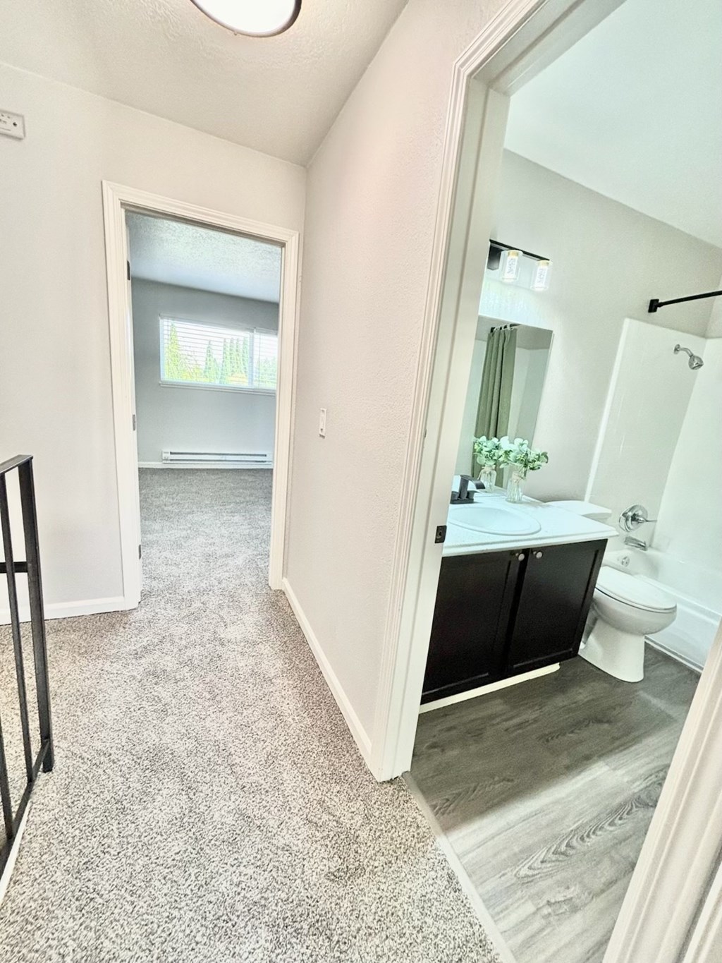 Campbell Plaza Apartments
710 Nido Drive, Campbell, CA 95008. A bathroom with a toilet, sink, and mirror.